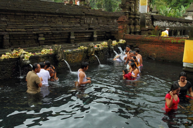Taking a holy bath at the Pura Tirtha Empul, Bali, Indonesia