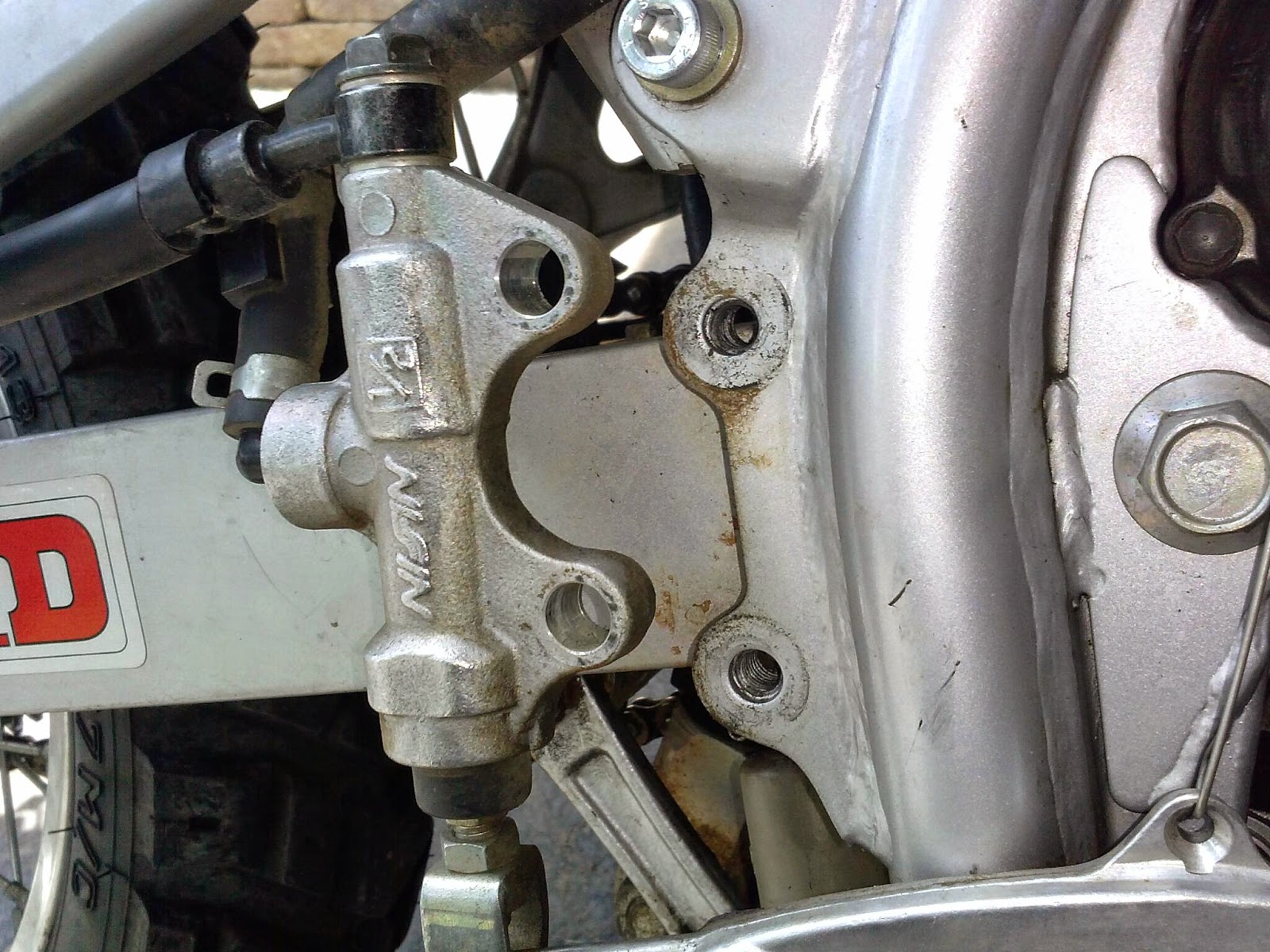 Geoff's KLR650 project Installed Eagle Mike's rear brake pedal mount