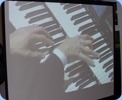 The hands of Hector Olivera on a Roland Atelier organ - shot taken from big screen and the perforance was shot from a video clip courtesy of Doug Farr