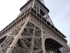 The Eiffel Tower, located on the Champ de Mars in Paris, is global cultural icon of France and one of the most typical structures in the world.