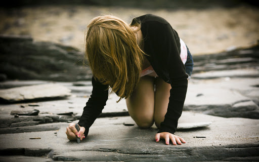 Girl Writing with Stone