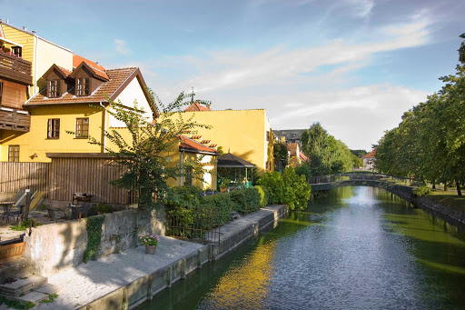 Homes running along a scenic canal in Frederiksværk, Denmark.