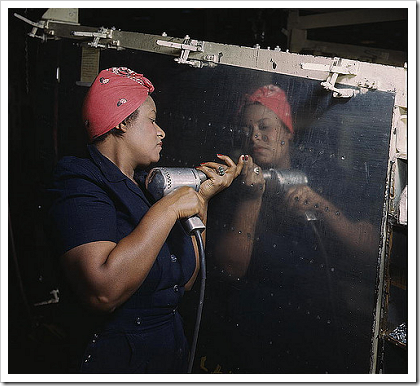 Woman working on a dive bomber (1943)