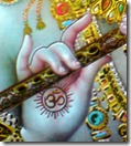 Lord Krishna holding His flute