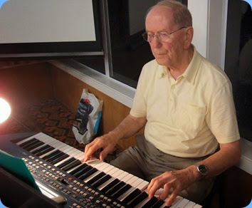 John Beales playing the arrival music on his Korg Pa500. Photo courtesy of Dennis Lyons