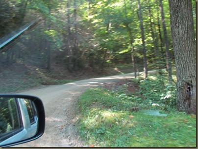 5 mile dirt and gravel narrow road off the mountain....you might meet a motor home coming the other way.