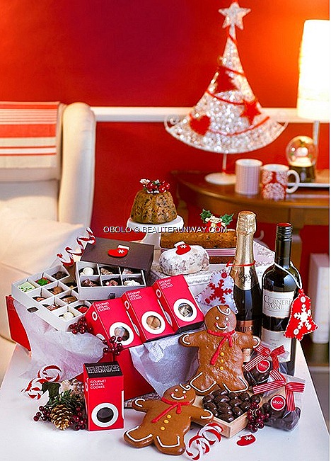 Obolo Christmas Gourmet Food Hampers Traditional fruitcake Christmas pudding stolen Gingerbread man  Gourmet cookies Chocolate pralines Dark chocolate almonds Wine Sparkling juice Tempt $79 Excite $139 Thrill $199 Impress $239
