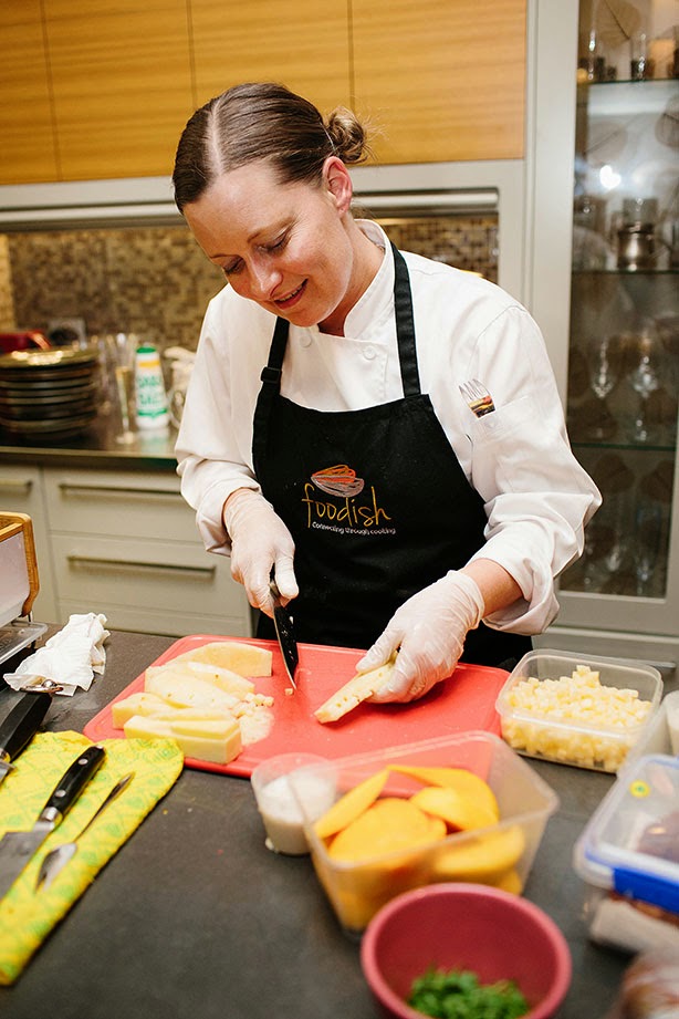 Chef Vanessa Scanes of Foodish prepares tropical fruit for the dessert, using produce from Fyshwick Fresh Food Market. HerCanberraDinner149.jpg