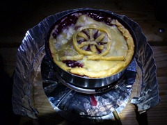 Pie on a campstove. Bike wheel decoration included.