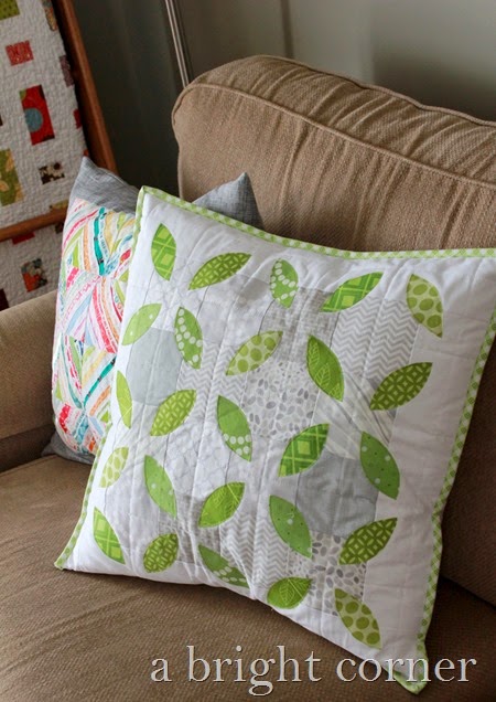 Summer Leaves quilted pillow tutorial - fun spring pillow and a great way to use scraps.  Tutorial from Andy of A Bright Corner