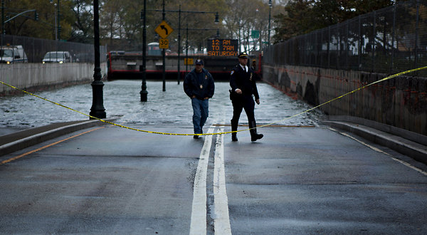 The flooded entrance to the tunnel leading to the Franklin D. Roosevelt Drive in Lower Manhattan after Hurricane Sandy, 30 October 2012. For nearly a decade, scientists told city and state officials that New York faces certain peril: rising sea levels, more frequent flooding, and extreme weather patterns. Damon Winter / The New York Times