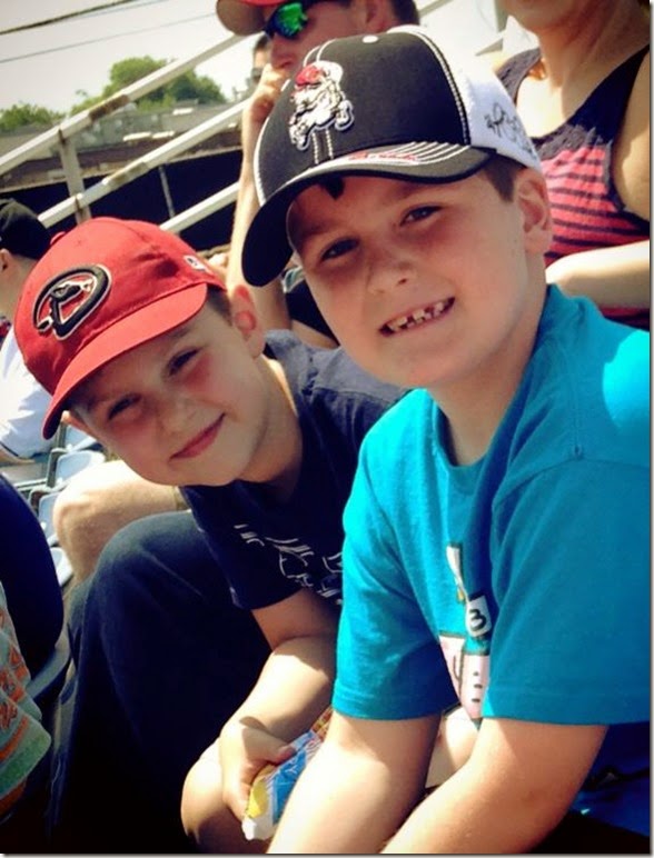 Elijah with friend at Sounds game last day of 2nd grade 5 20 14