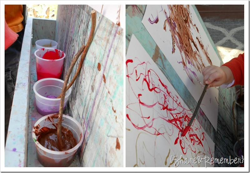 painting with sticks in preschool
