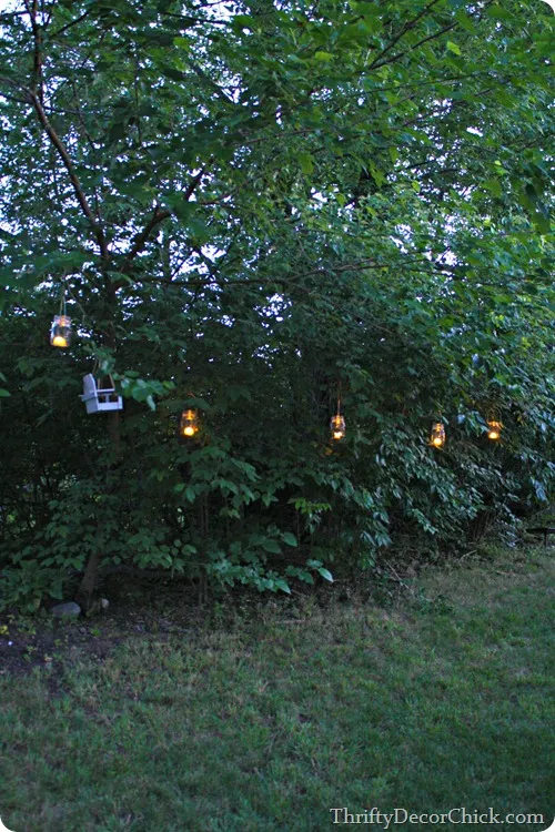 mason jar lanterns in trees