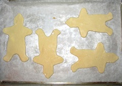 sugar cookie gingerbread men on sheet