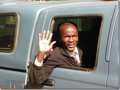 Ssenyonga waving good-bye