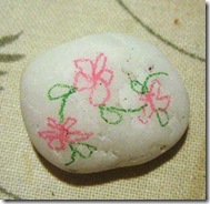 white pebble with a little drawing white pebble with a little drawing