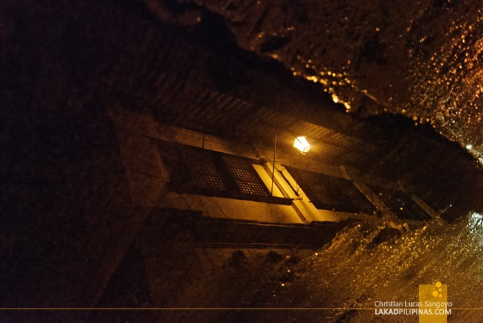 A Puddle Reflecting an Ancestral House
