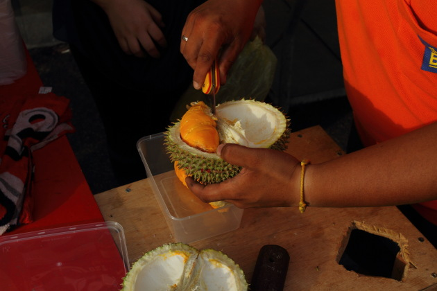 The pungent Durian fruit being cut