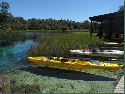 kayaks floating on crystal clear water at headspring