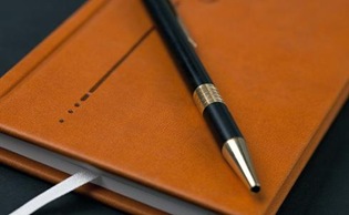 Brown diary and pen