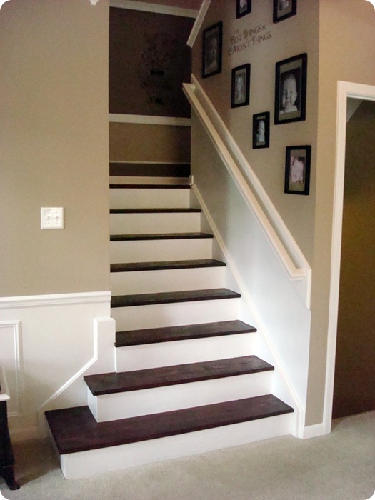 wood white stairs with gallery wall