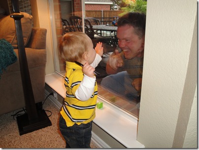 7.  Playing with Daddy through the window