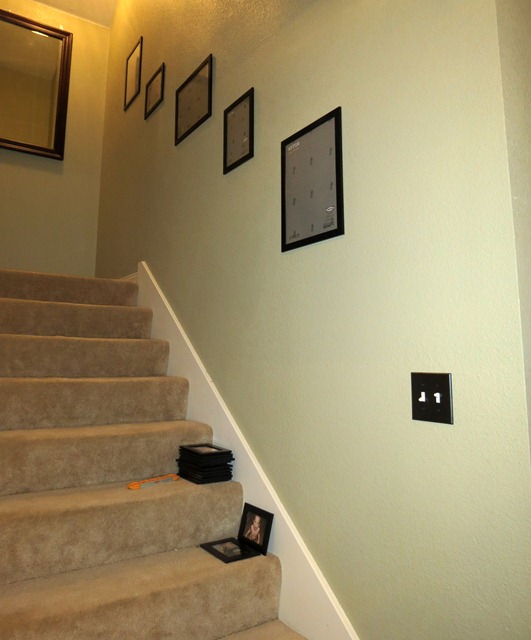 use velcro to hang pictures on stairway 5