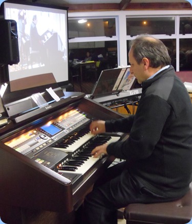 Long time member, Doug Farr, playing our Technics GA3 organ