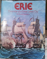 c0 Erie: Chronicle of a Great Lakes City, by Edward Wellejus; hardcover, with dust jacket; some warping, but not from water damage; perhaps due to original binding?