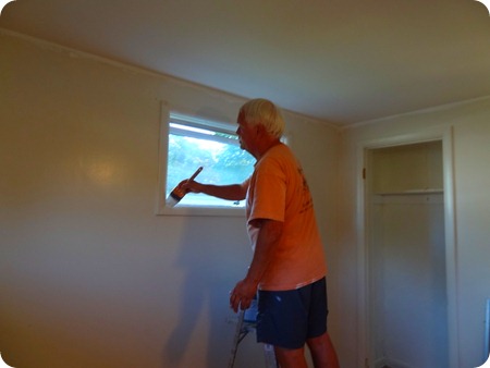 Paul painting windows.