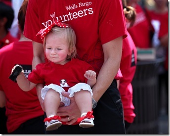 REBECCA BARNETT  |  The Roanoke Times  
August 25, 2011 Donny Smith of Roanoke holds his daughter, 17-month-old Madeline, before the start of Wells Fargo's parade in downtown Roanoke Thursday. Donny is an analyst for Wells Fargo and said he brought Madeline so she could see the stagecoach. 
