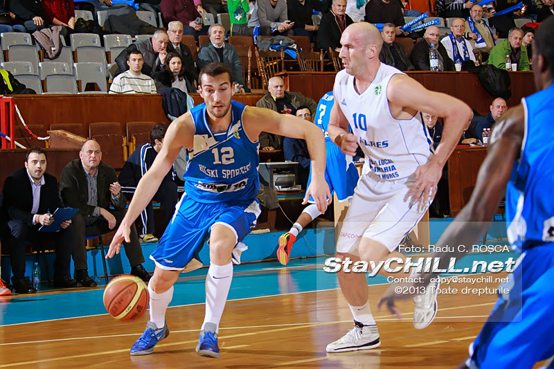 Zlatin Georgiev drives the ball against Ivan Ivanovic in the FIBA EuroChallenge game between BC Mures from Romania and Rilski Sportist from Bulgaria played at City Arena in Tirgu Mures on December 17th, 2013.