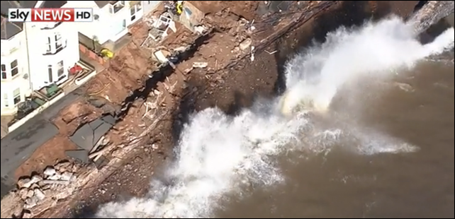 Aerial view of waves eroding through the Dawlish rail line in Devon. Southern Britain was hit by hurricane-force winds and heavy rain, combined with high tides, on 8 February 2014. Photo: Sky News