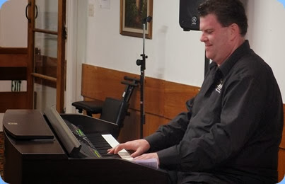 Our guest artist, Chris Larking, played a few straight piaon pieces on our Yamaha Clavinova CVP-509. Photo courtesy of Dennis Lyons