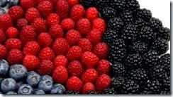 stock-footage-berry-good-arrangement-of-raspberries-blueberries-and-blackberries-rotates-on-plate-against-white