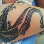 Big dragon on woman leg - tattoos for women