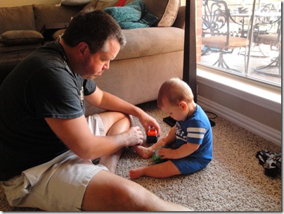 1.  Daddy teaching Knox how to play with his first cars