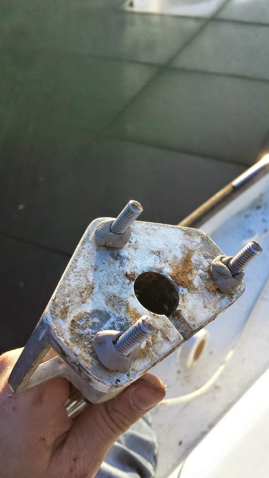 Sasha Rebedding the deck hardware