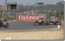 Grosjean supera Button tagliando al chicane