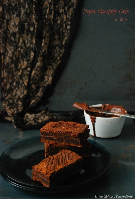Vegan chocolate cake with vegan ganache frosting_stacked with cloth
