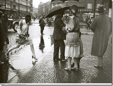 Jumping over a puddle near Berlin Zoological Garden station,1930 by Friedrich Seidenstücker
