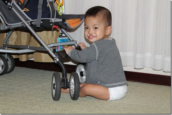 So adorable, even when he's banging the stroller into the lamp.