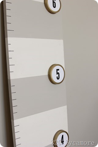 use canning lids spray painted gold for growth chart