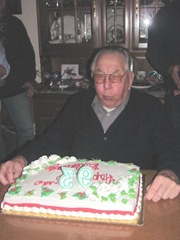 12.10.2011 dads 93rd bday dad blowing out candles cake