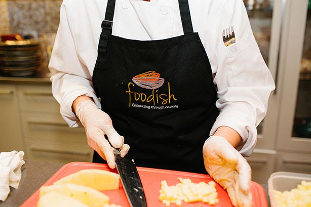 Chef Vanessa Scanes of Foodish prepares tropical fruit for the dessert, using produce from Fyshwick Fresh Food Market. HerCanberraDinner151.jpg