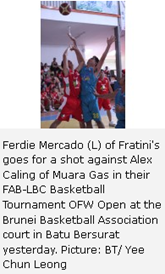 Ferdie Mercado (L) of Fratini's goes for a shot against Alex Caling of Muara Gas in their FAB-LBC Basketball Tournament OFW Open at the Brunei Basketball Association court in Batu Bersurat yesterday. Picture: BT/ Yee Chun Leong 
