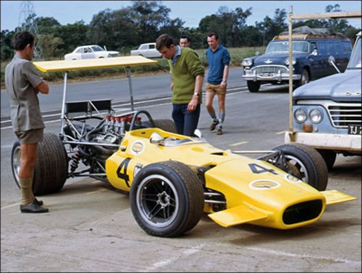 McNichol John SA race traver in blue shirt with his Lola T142 Pmaritzburg Easter1969 Race SouthAfrica McNicol was murdered  JUly312001 Vereeniging farm