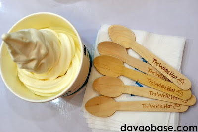 Enjoy plain frozen white yogurt with wooden spoons at The White Hat