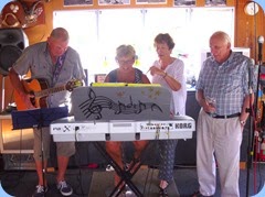 Kevin and Jan Johnston accompanied by Jeanette and watched-on by Rob Powell.